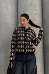 سترة تريكو بنقشة مربعات سوداء