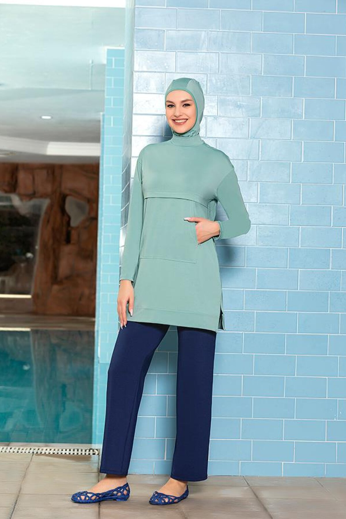 Turquoise Lycra Full Coverage Swimsuit with Kangaroo Pocket - Armes